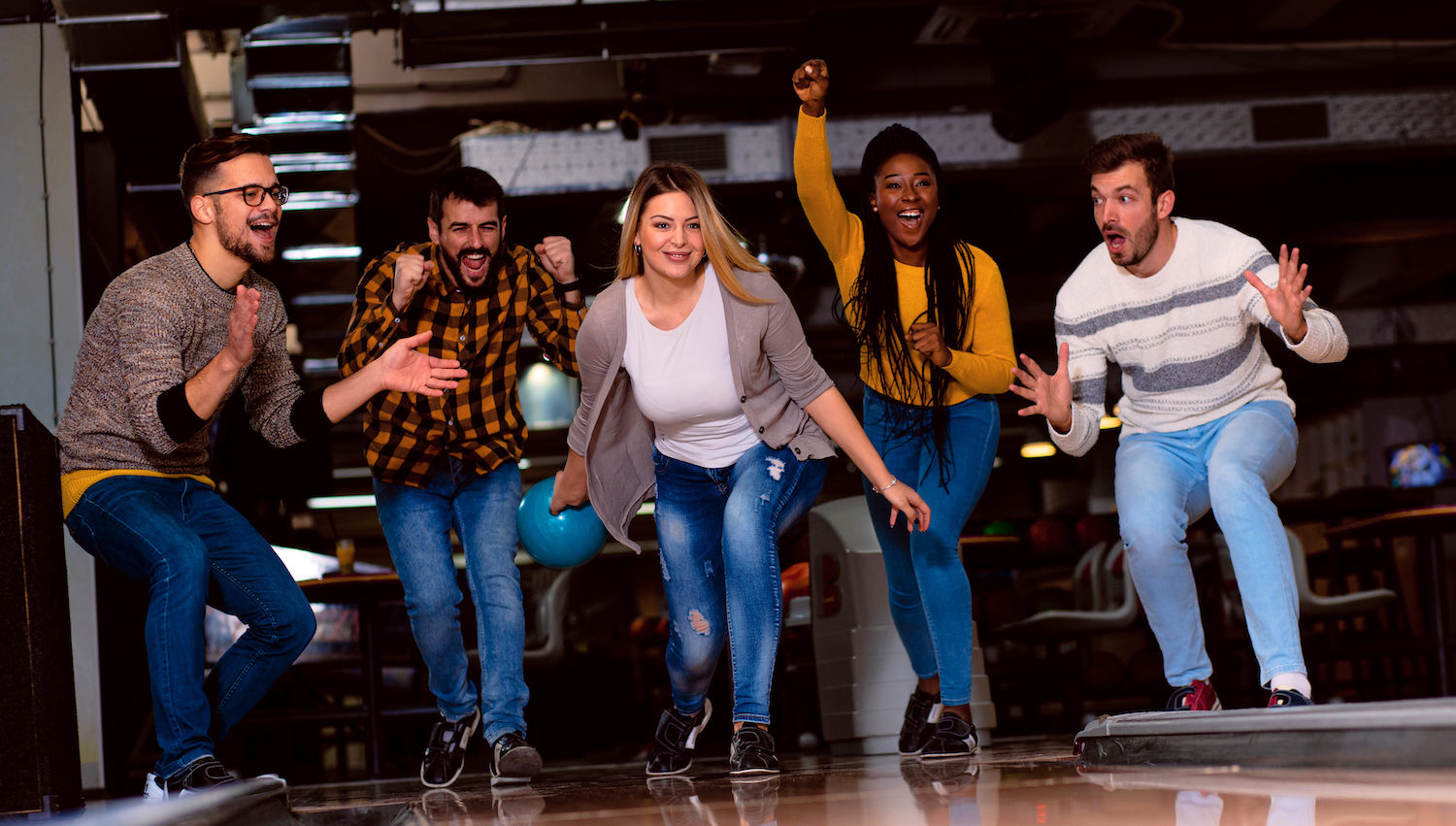 Group of friends bowling